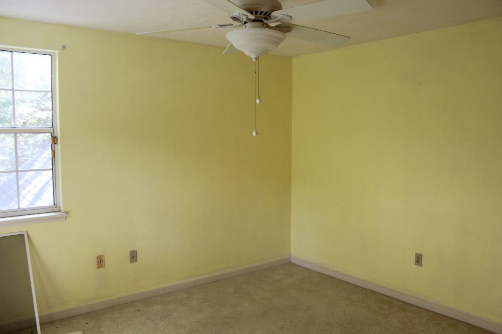 Yellow walls beige carpet