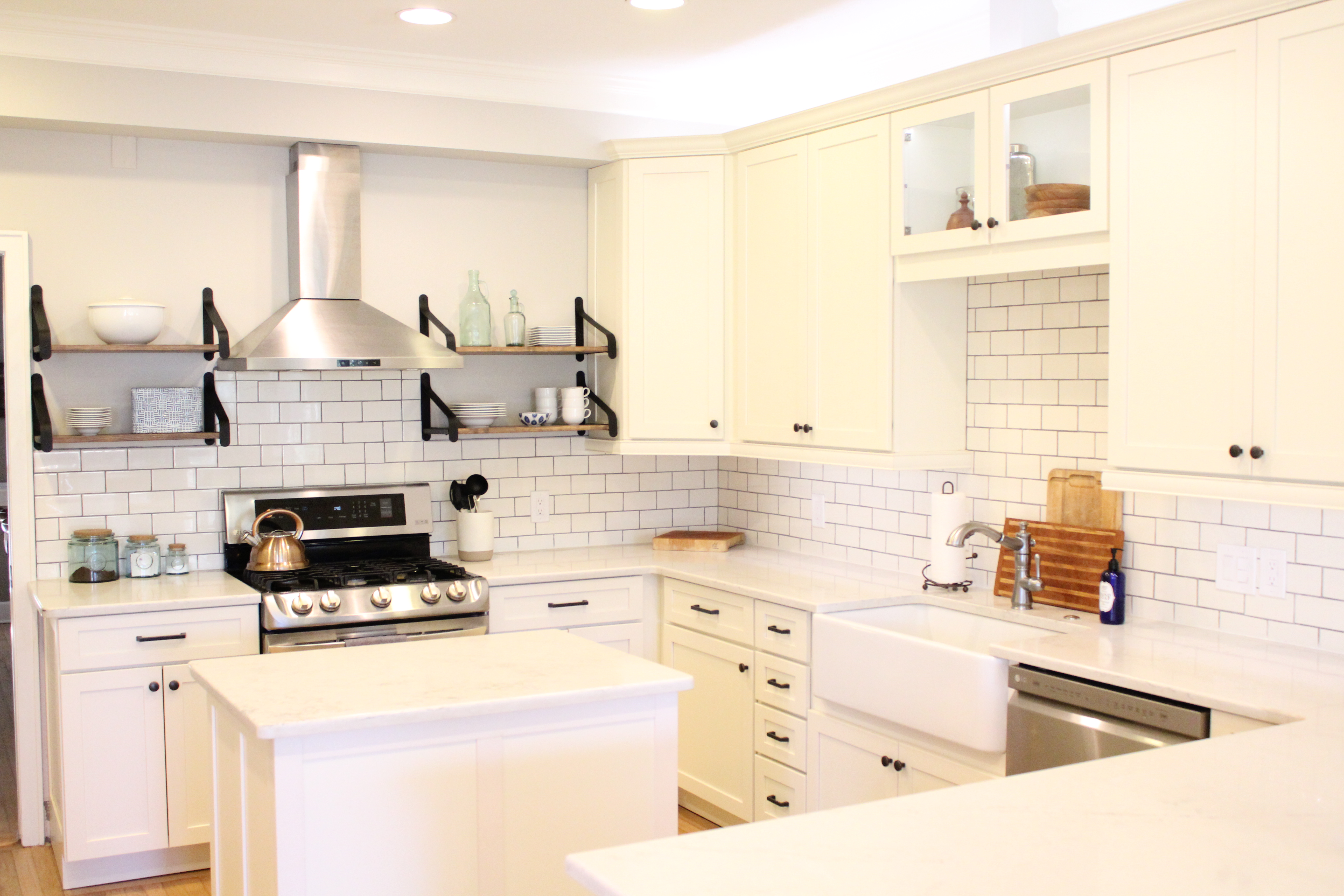 white kitchen cabinets subway tile marble counter