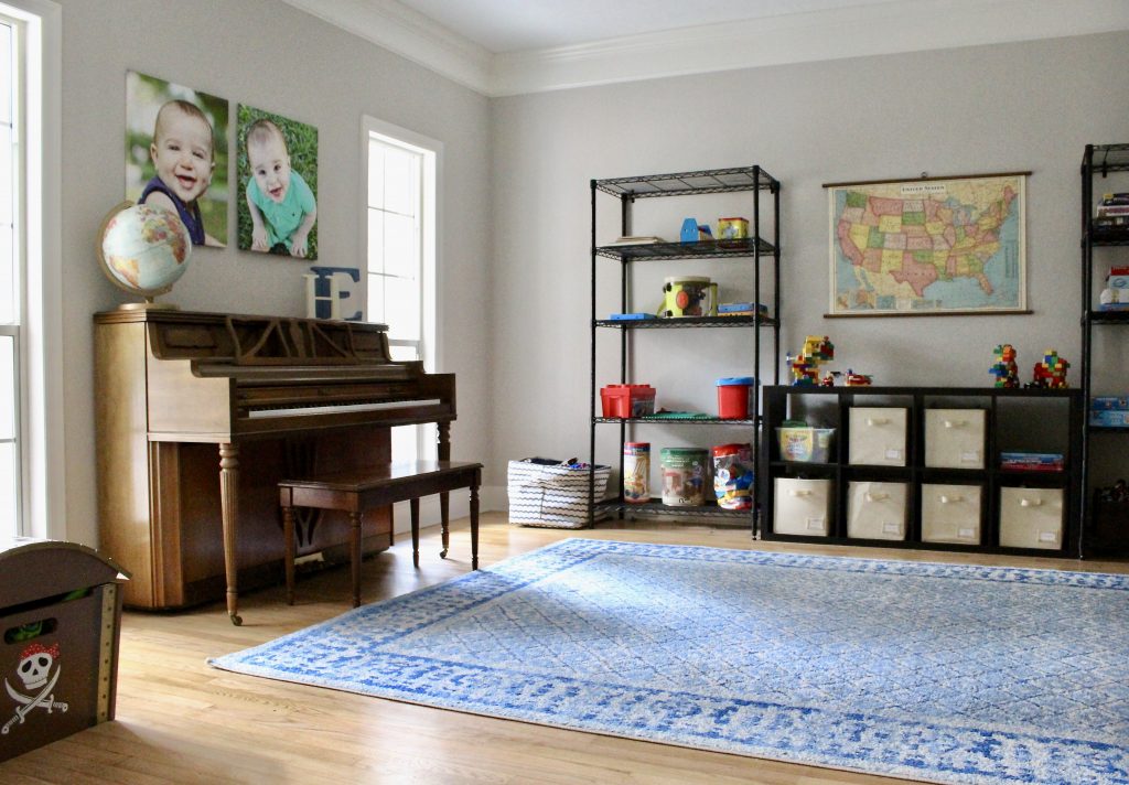 Playroom with piano and canvas prints