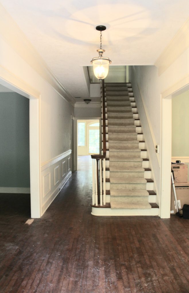 Stairway before with dirty carpet