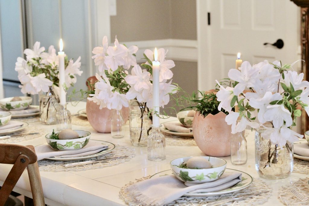 easter tablescape with white flowers and plants