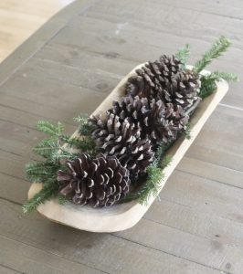 Neutral Christmas Decor - centerpiece made of pine tree trimmings clippings greenery and pine cones in wooden dough bowl | www.ourhammockhouse.com 
