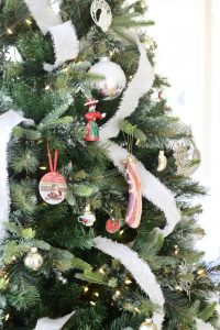 Neutral Christmas Decor - artificial Christmas tree with cream cascading ribbon and bacon slice tree ornament | www.ourhammockhouse.com 