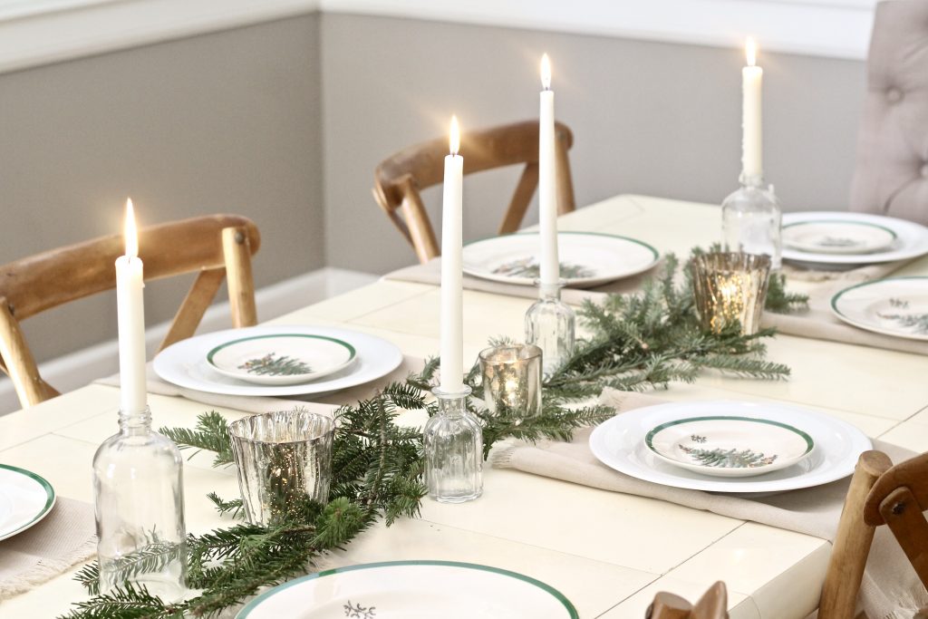 Christmas tablescape table setting with pine tree branches in center of table and mercury glass candleholders | #Christmasdecor #tablescape 