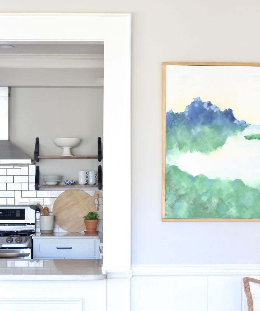Large framed abstract art with white kitchen with open shelving #DIY #abstractart #abstractpainting #abstractlandscape #DIYart #whitekitchen #openshelving 