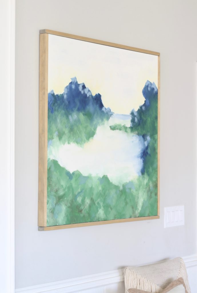 DIY large framed abstract landscape art with blue, green, white, yellow, and gray. Make your own designer inspired art for less than $60! #DIY #abstractart #abstractpainting #abstractlandscape #DIYart 