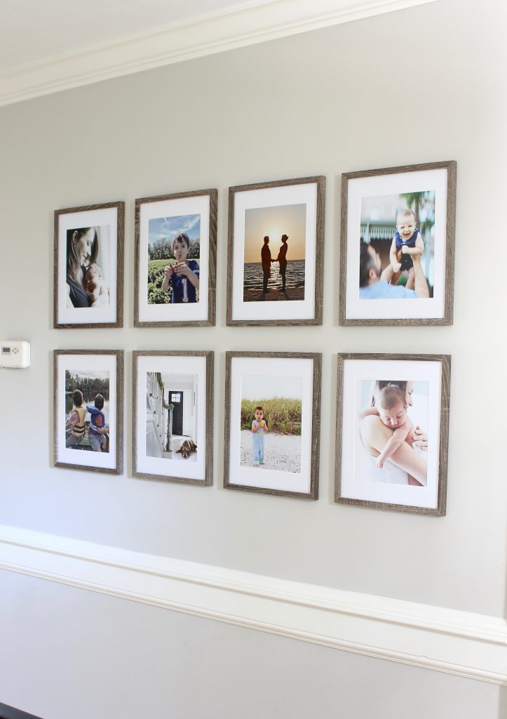 Tips for choosing photos for your grid-style gallery wall | www.ourhammockhouse.com | #gallerywall #gridstylegallerywall #blackhandrail #familyphotos 