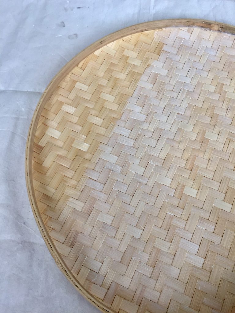Painting white wash onto woven basket tray